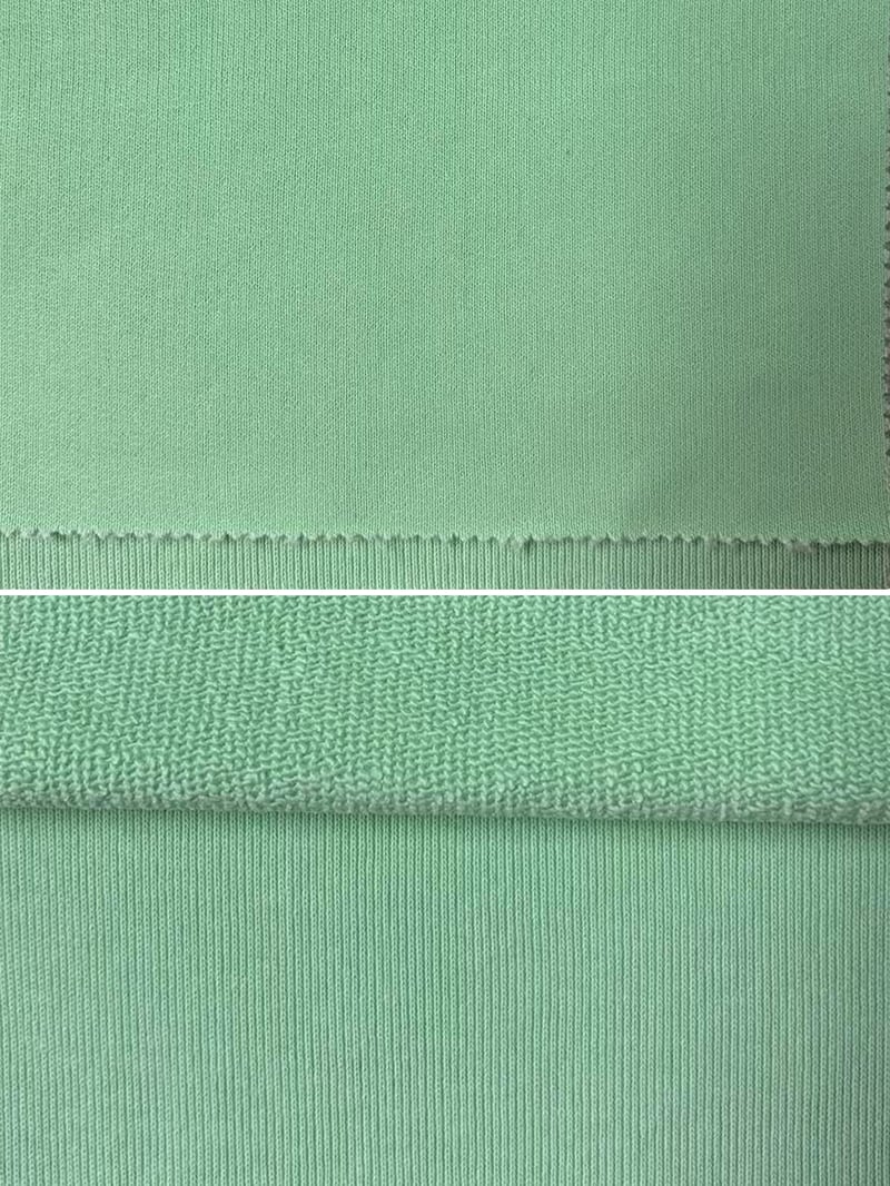 Garment-dyed cotton french terry fabric swatches showing vintage wash colors for heavyweight hoodie manufacturing