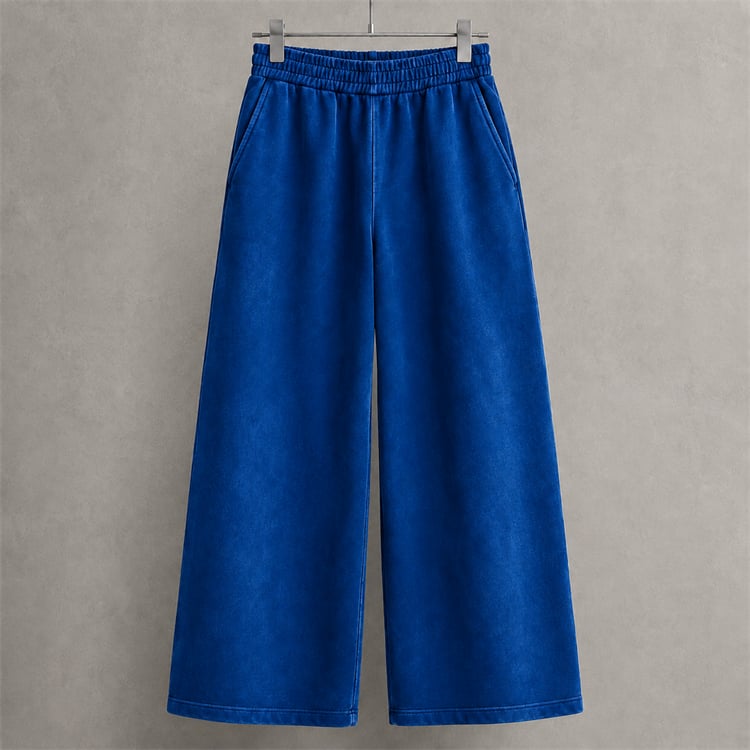 Cobalt blue heavyweight wide-leg sweatpants with a structured streetwear silhouette