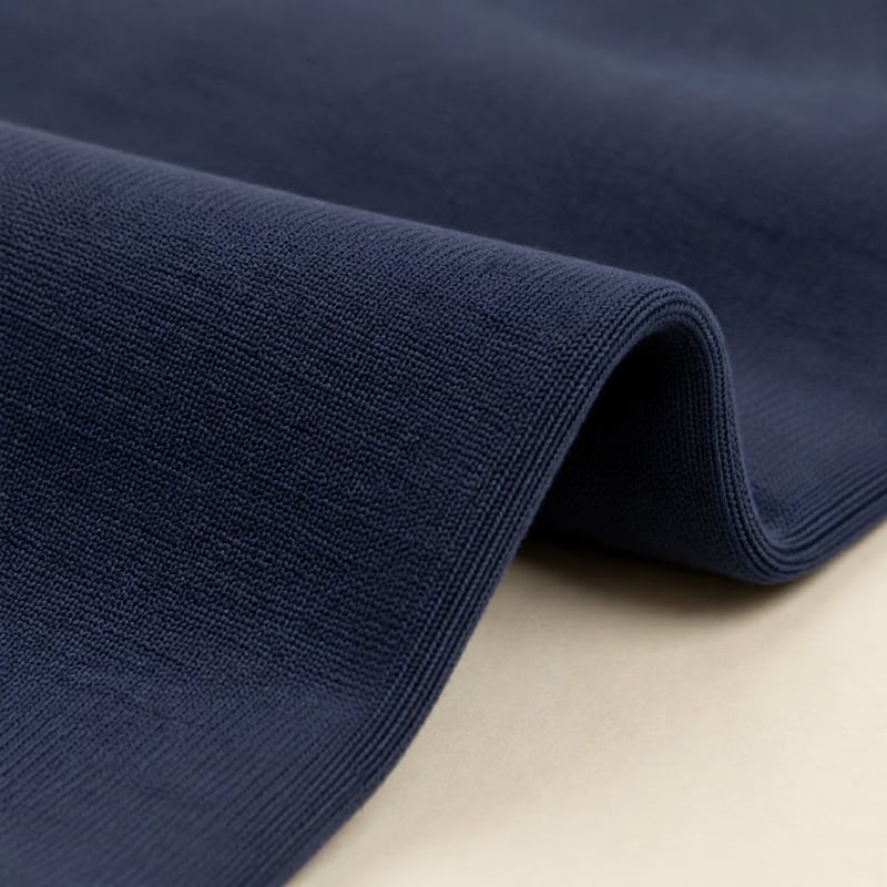 Navy cotton-rich blend fabric with a compact knit and stable structure