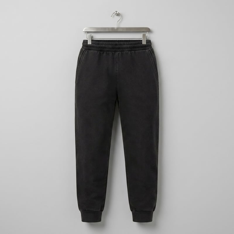 Washed black jogger sweatpants with tapered legs and ribbed cuffs