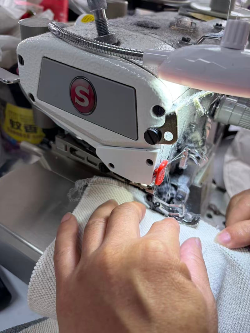 Industrial Sewing Control For Thick French Terry:Thick Seam & Needle Breakage Prevention  400–500 GSM fleece requires specialized sewing adjustments during production.  Our operators reduce sewing speed in high-density areas and calibrate machine tension to improve stitch consistency and reduce needle overheating.  This helps prevent:  skipped stitches broken needles seam popping uneven stitching on thick fabric layers  Especially in:  hood seams shoulder joins rib connections pocket corners